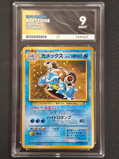 A graded Pokémon trading card of Blastoise from the 1999 Promo set, sealed in a clear plastic grading holder with a PSA 9 Mint label at the top, set against a dark textured background.