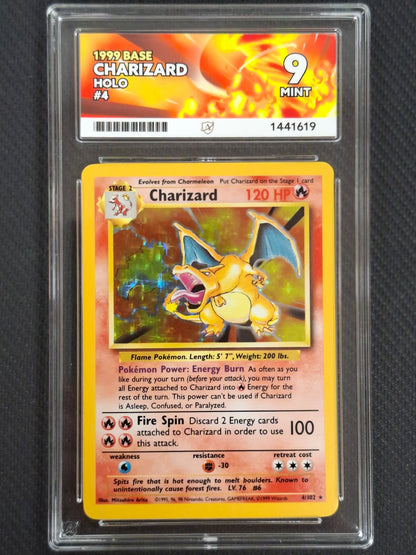 A graded 1999 Charizard base trading card held in a clear plastic slab. The slab label at the top reads '1999 BASE CHARIZARD HOLD #4 9 MINT' with a fiery orange and yellow design.