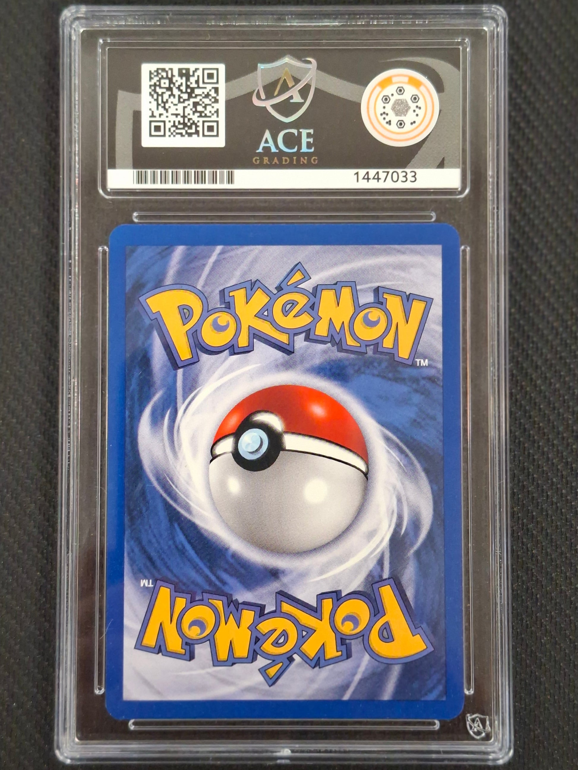A graded Pokémon trading card in a clear plastic protective slab, showing the back of a card with a blue background, Pokémon logo, and a red-and-white ball graphic. The slab has a header card with a QR code, ACE Trading logo, and grading details.